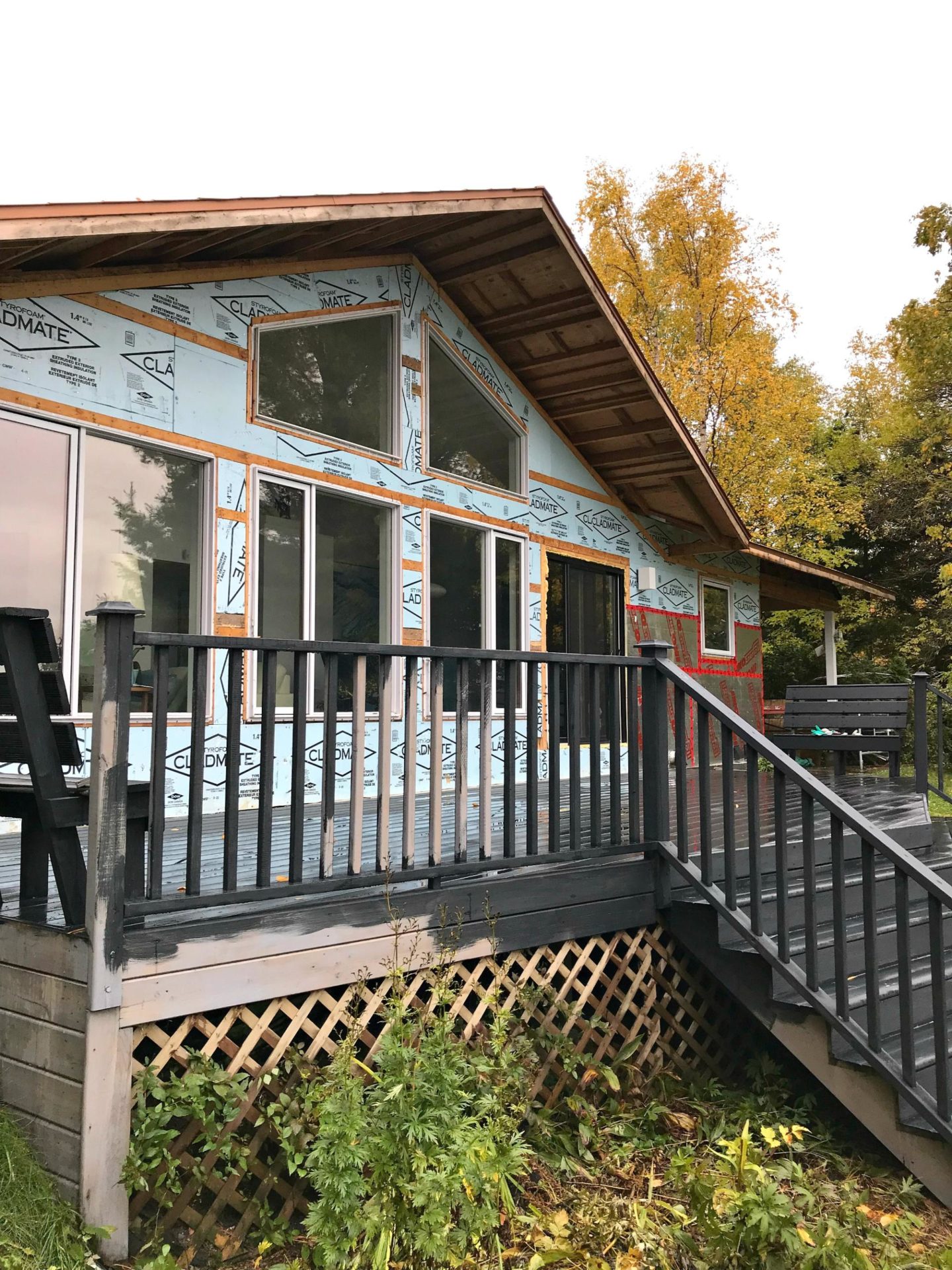 Olympic Black Deck Stain in Mystic Black and Veranda Copper Solar Deck Caps | Staining the Deck Black with Dans le Lakehouse