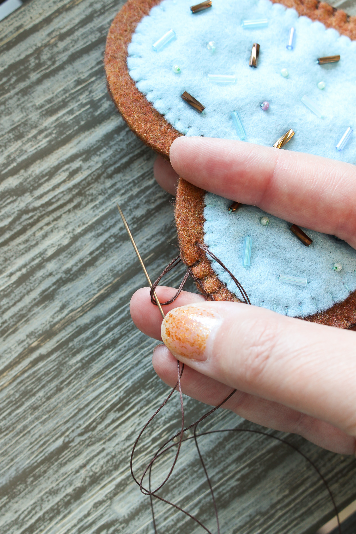 How to stitch closed felt ornaments
