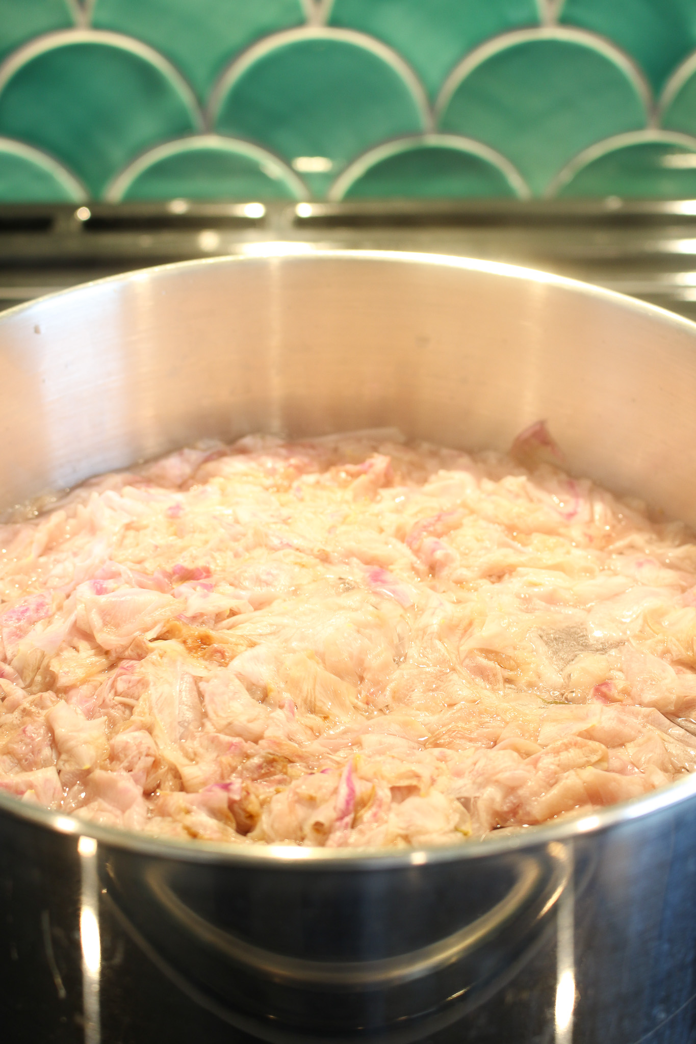 Once the petals have lost their color, remove from heat and strain.