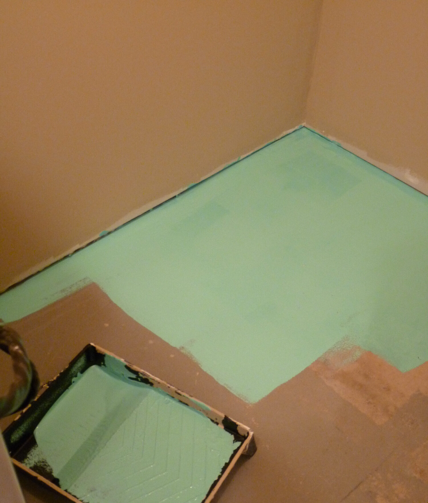 How to Paint a Concrete Floor - Turquoise Laundry Room Floor