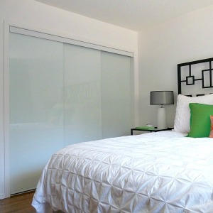 New White Glass Sliding Closet Doors in the Bedroom!