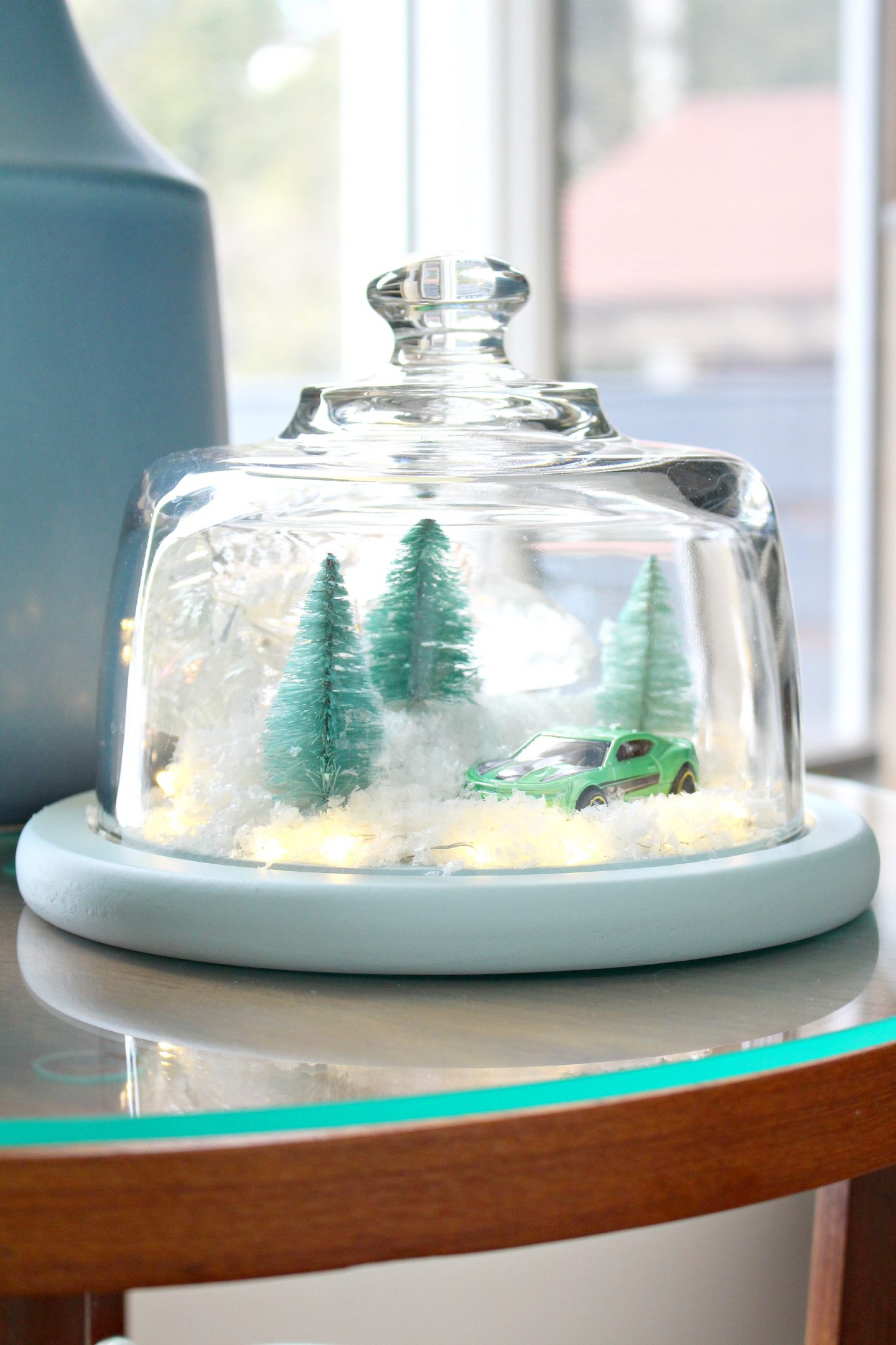 DIY Winter Diorama | aka The Camaro Cloche. Make this easy winter decor using a thrifted cheese cloche. Camaro themed holiday decor, lol! #diy #holidaydecor 