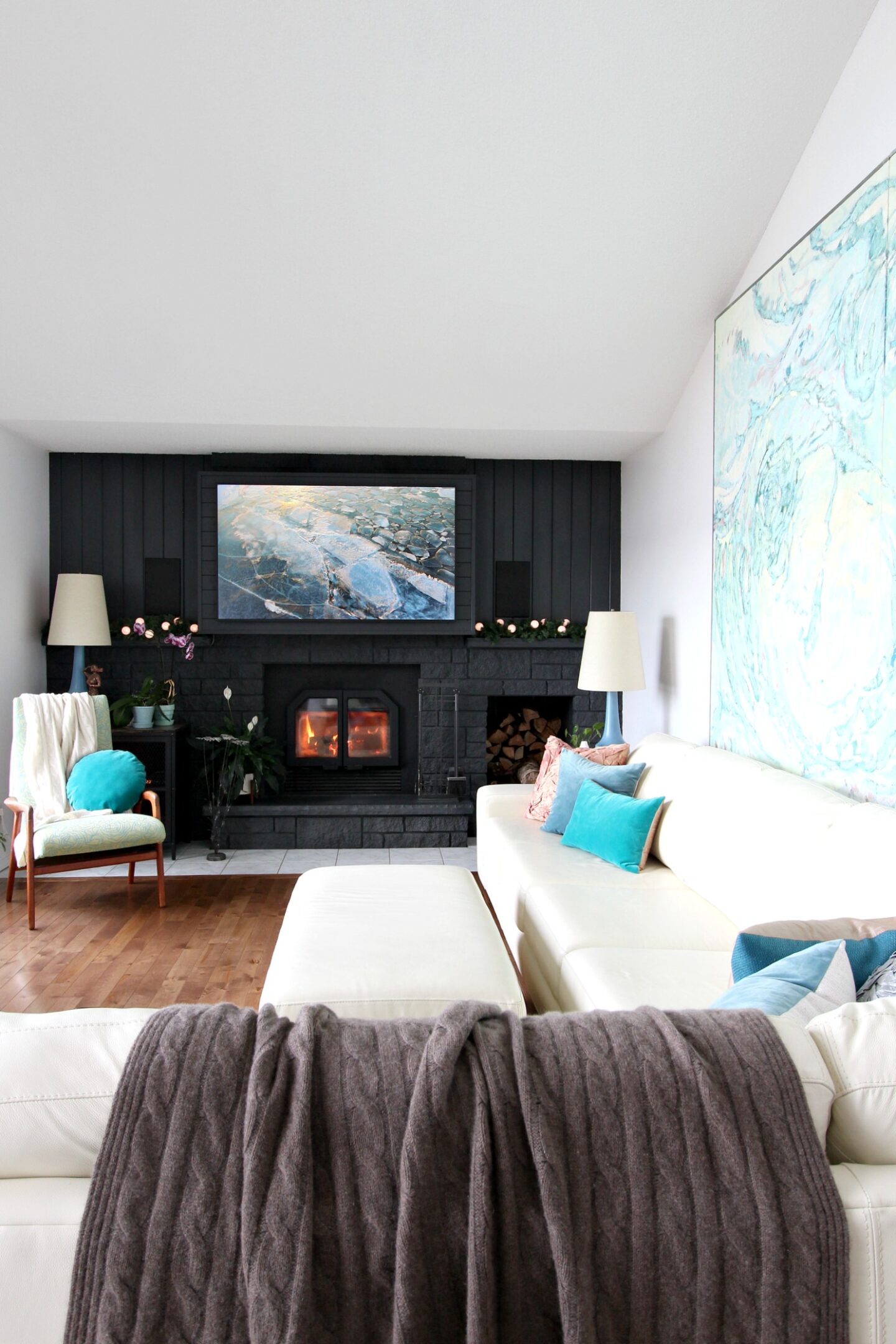 Black Fireplace with Pop of Color Artwork