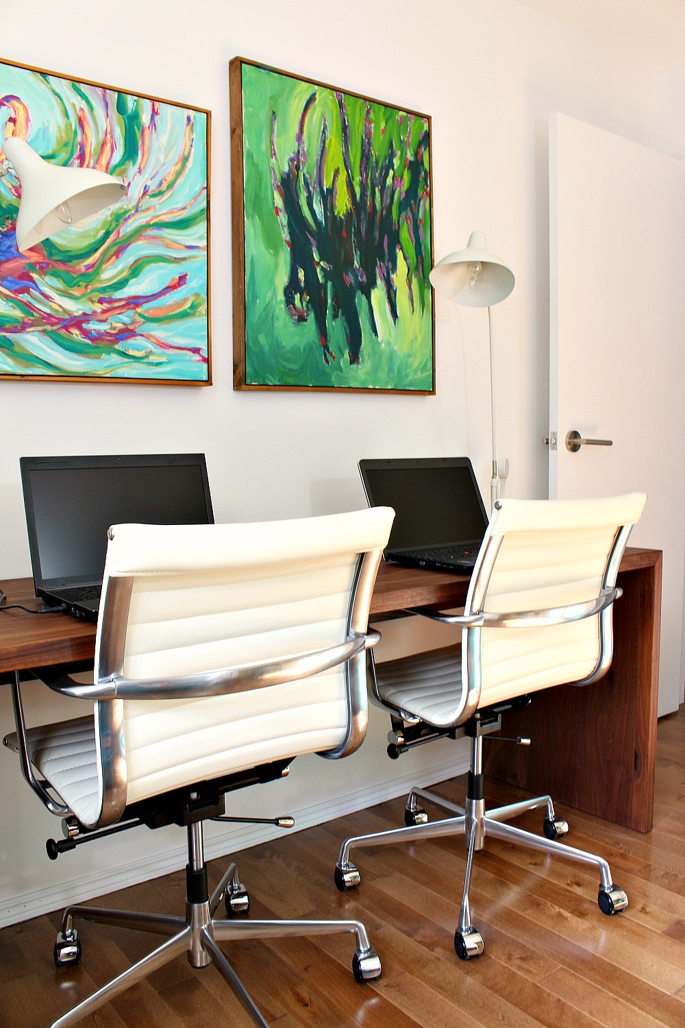 Mid-Century Office Design with Bold Abstract Art Above a Walnut Desk