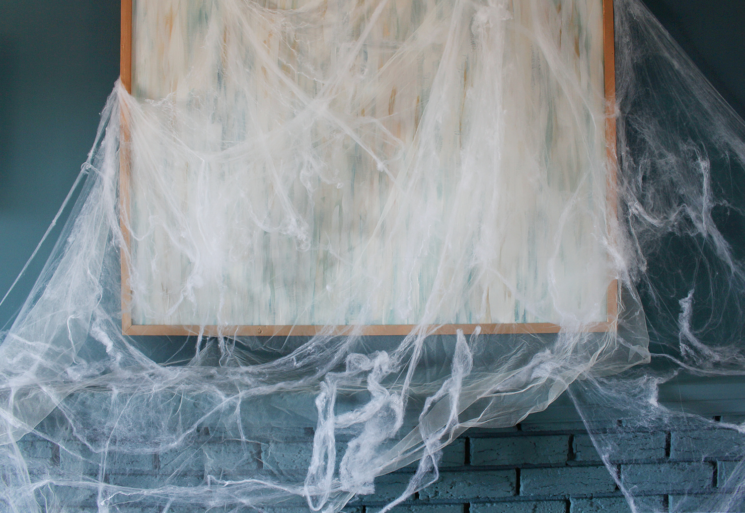 Fake Spiderwebs on Blue Mantel
