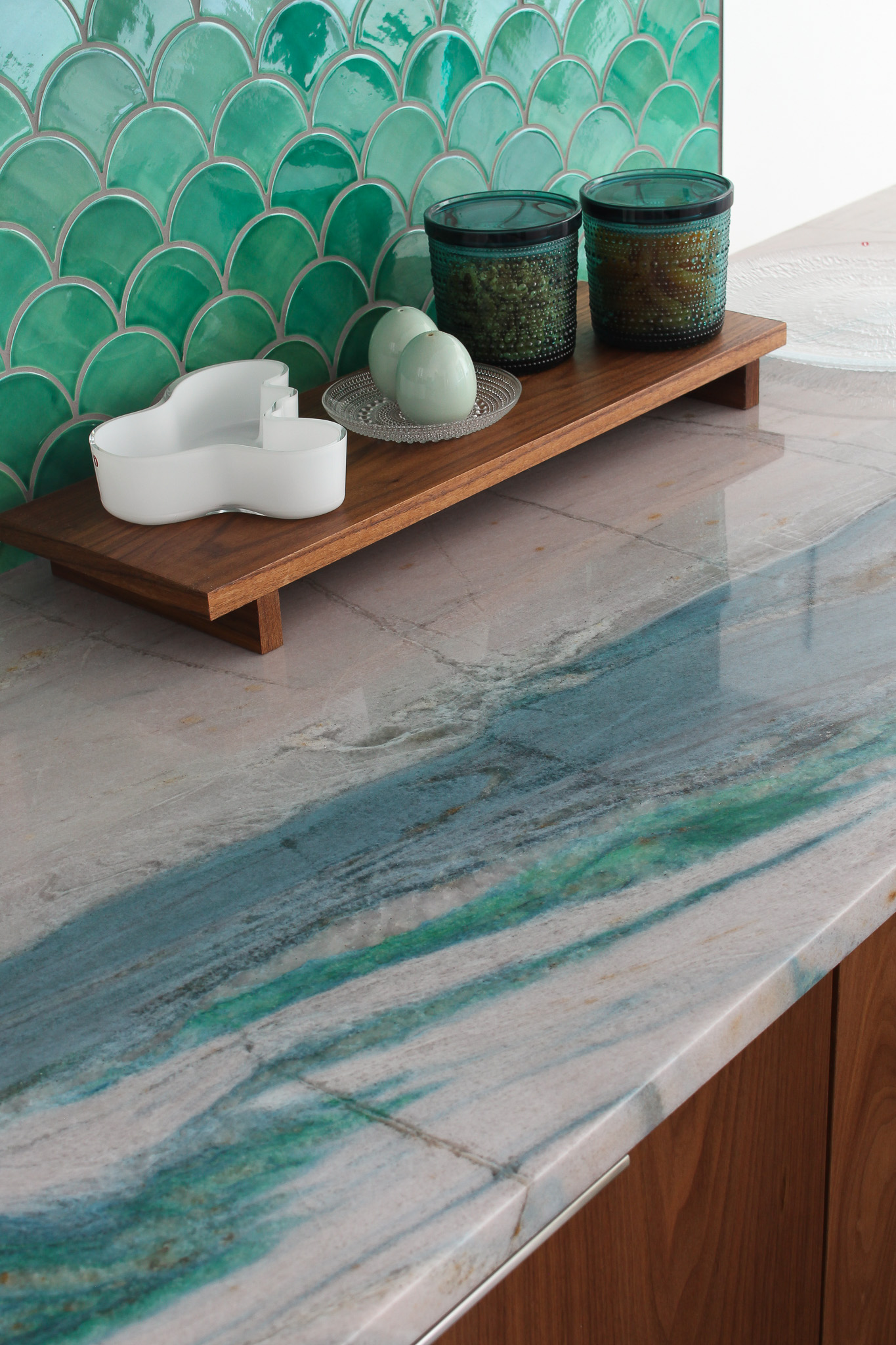 Dopamine Kitchen Renovation with Colorful Stone Counters and Green Backsplash